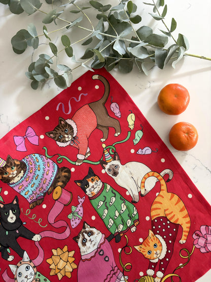 Cats' Christmas Morning napkin with clementines and eucalyptus