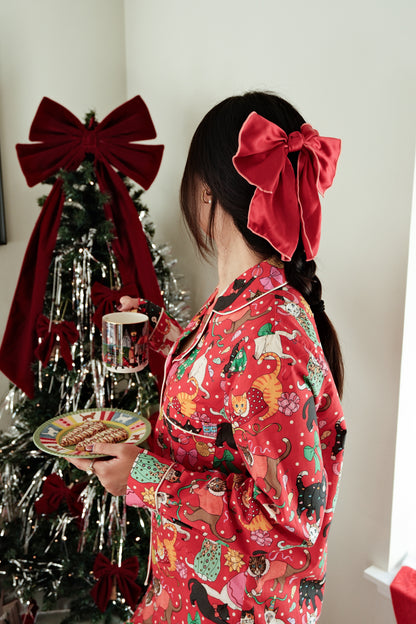 Cats' Christmas Morning crimson pyjamas by the Christmas tree