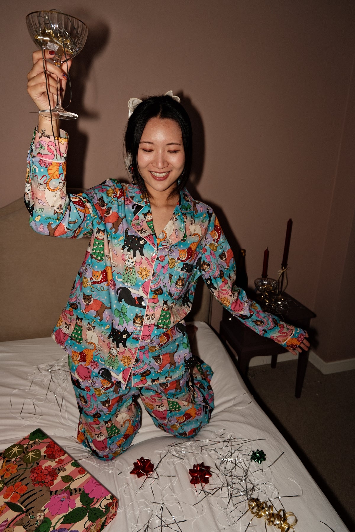 Cats' Christmas Morning rainbow pyjamas, celebrating