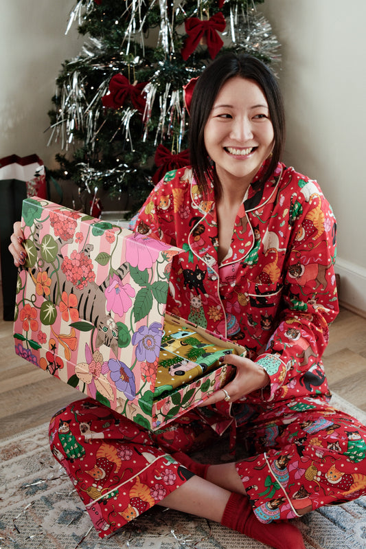 Cats' Christmas Morning crimson pyjamas, opening presents
