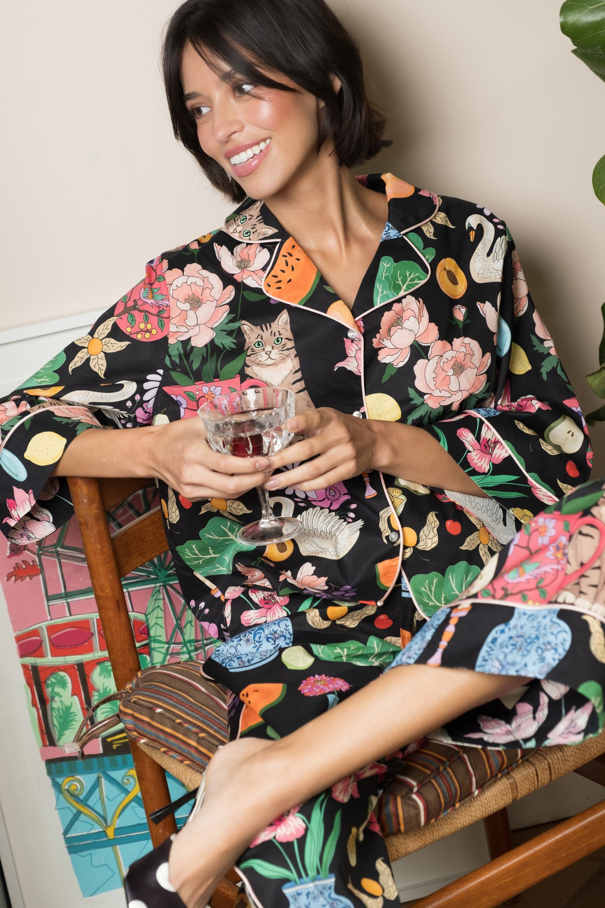 Midnight Tabletop pyjama trousers, hand in pocket, showing piping and hem detail