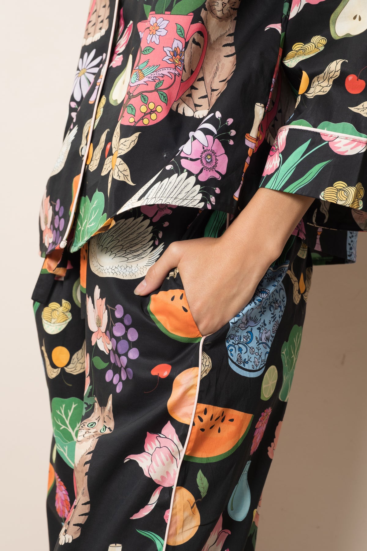 Side view of the midnight Tabletop organic cotton pyjama trousers and shirt