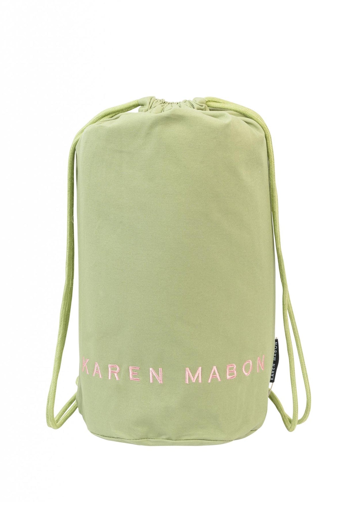 Pistachio green duffel bag with embroidered Karen Mabon logo in pink